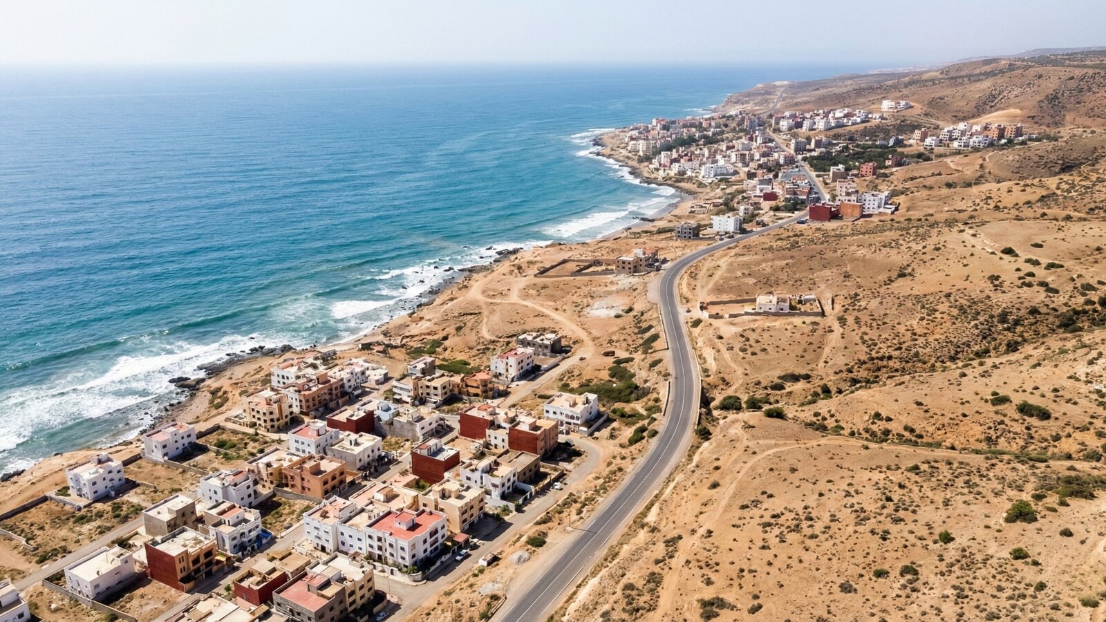 Aerial view of the Agadir coastline showing the road distance between Tamraght village and Taghazout surf spots
